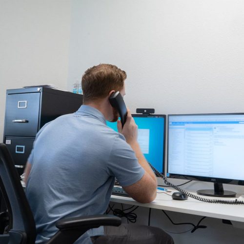 A Texas register agent answers customer questions at the Lone Star office in Austin.
