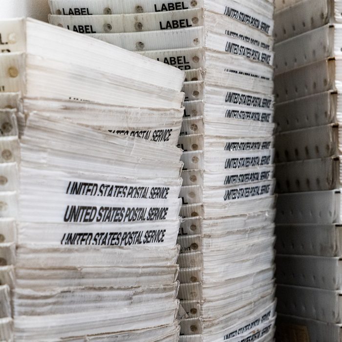 Stacks of mail bins at Lone Star Registered Agent in Texas.