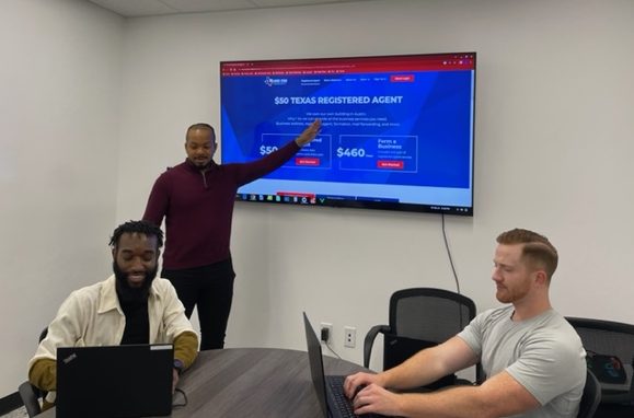 Three members of Lone Star Registered Agents in the conference room.